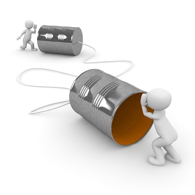 two plasticine figures using tin cans and string to contact each other