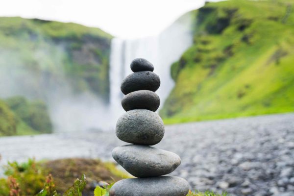 balancing pebbles while being empathetic