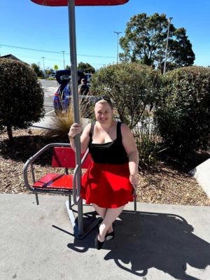 fiona sitting on old style chair lift seat