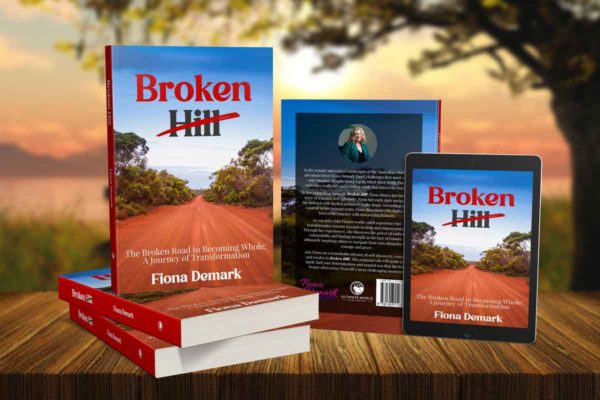 images of Fiona's book showing the front and back cover sitting on a table with a tree and sunset in the background