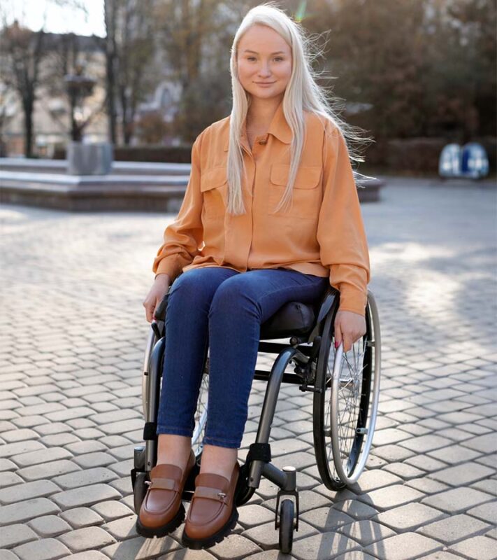 woman in wheelchair. She is not broken