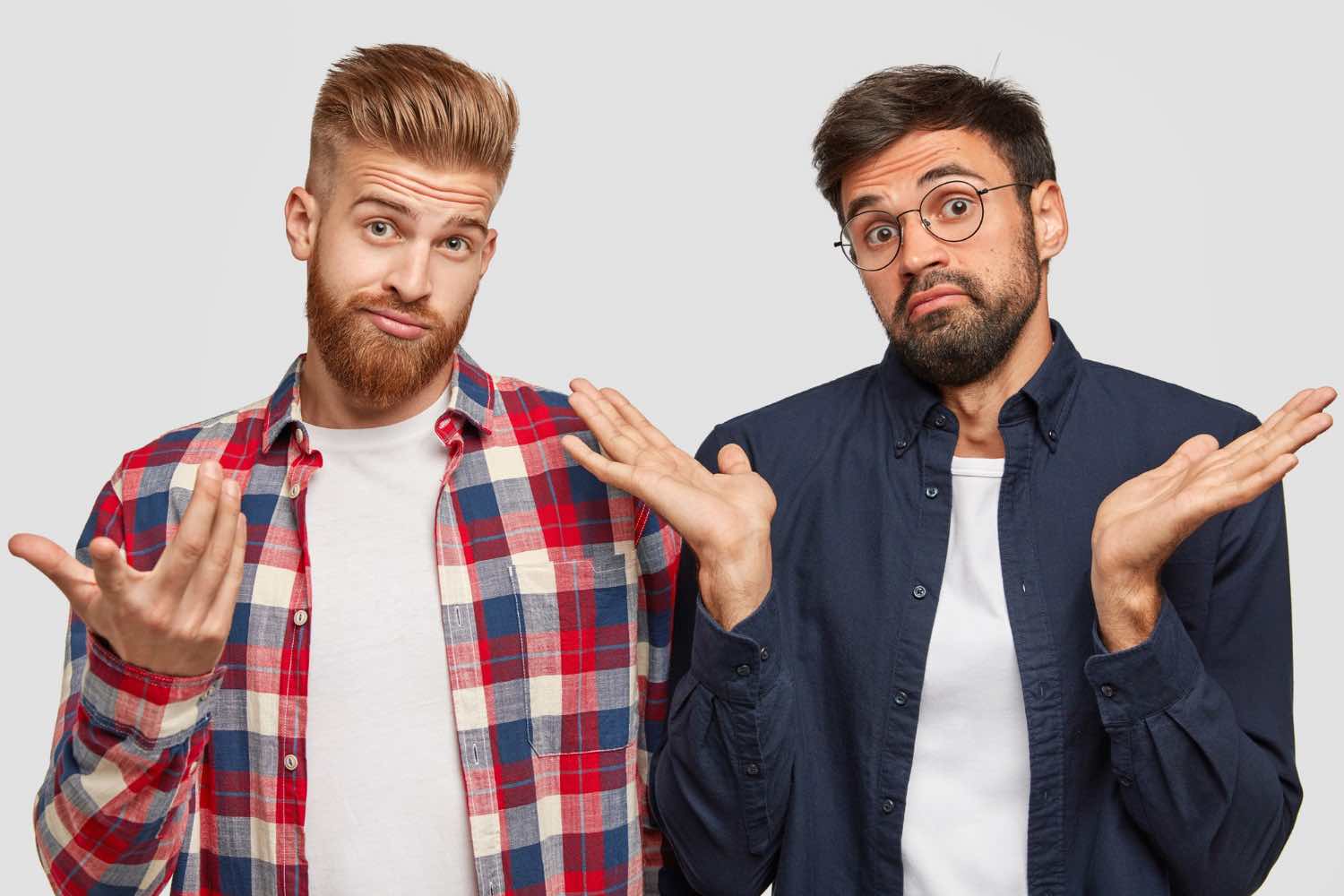 two bearded men comparing themselves against each other